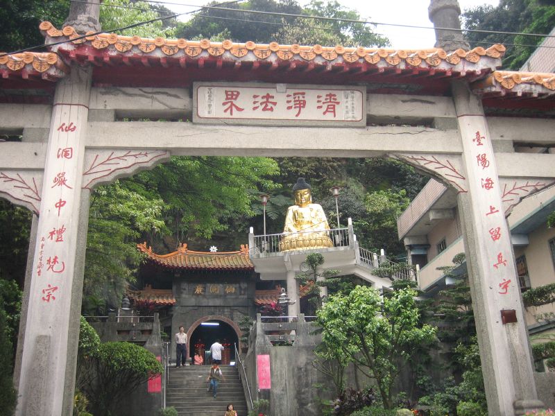 a large arch with a statue in it