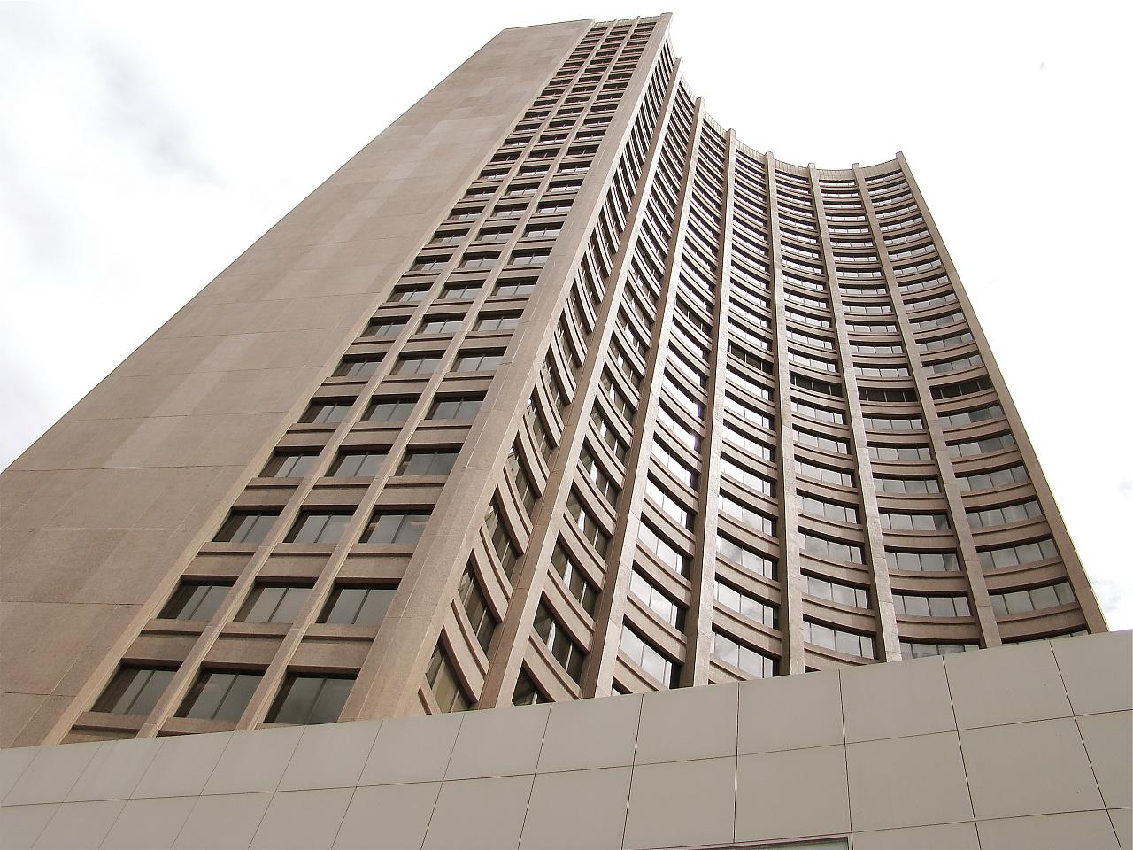 a high rise building sitting next to the sky