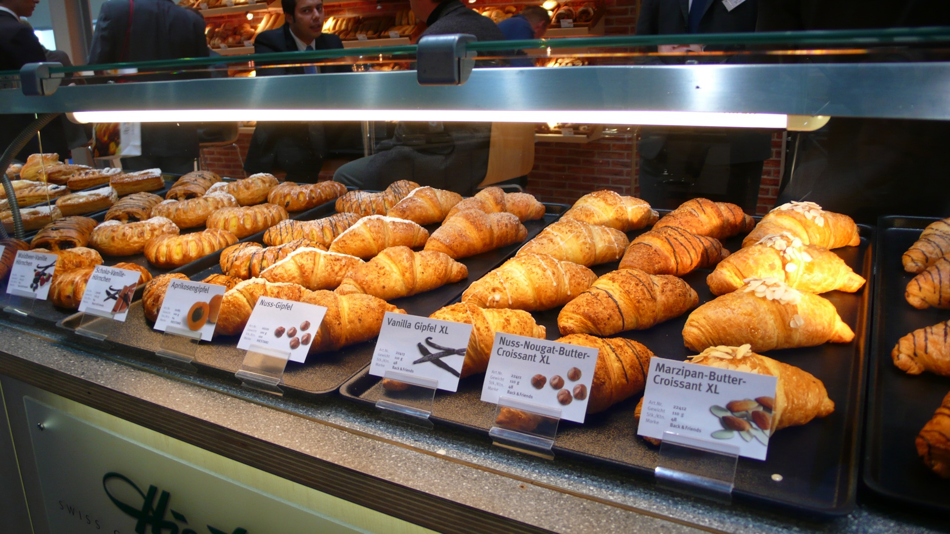 pastry items for sale at a display in a restaurant