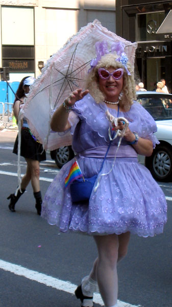 there is a woman dressed in purple and holding an umbrella