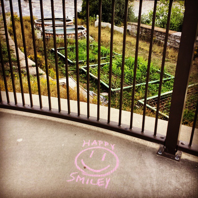 a sign in a doorway saying happy smiley