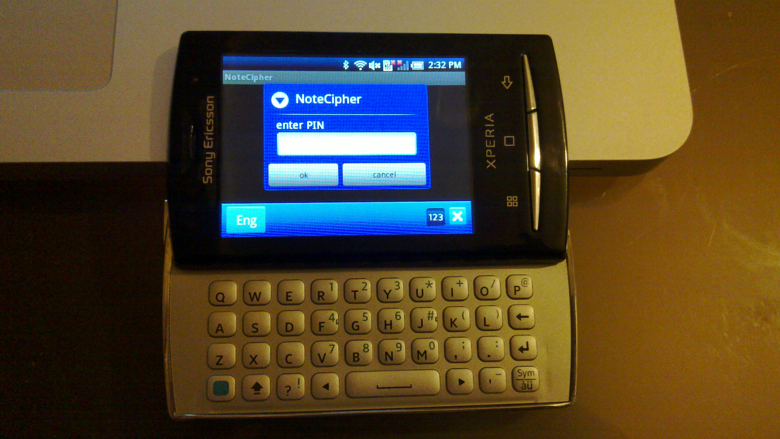 an open flip - style smart phone displaying the internet on its screen