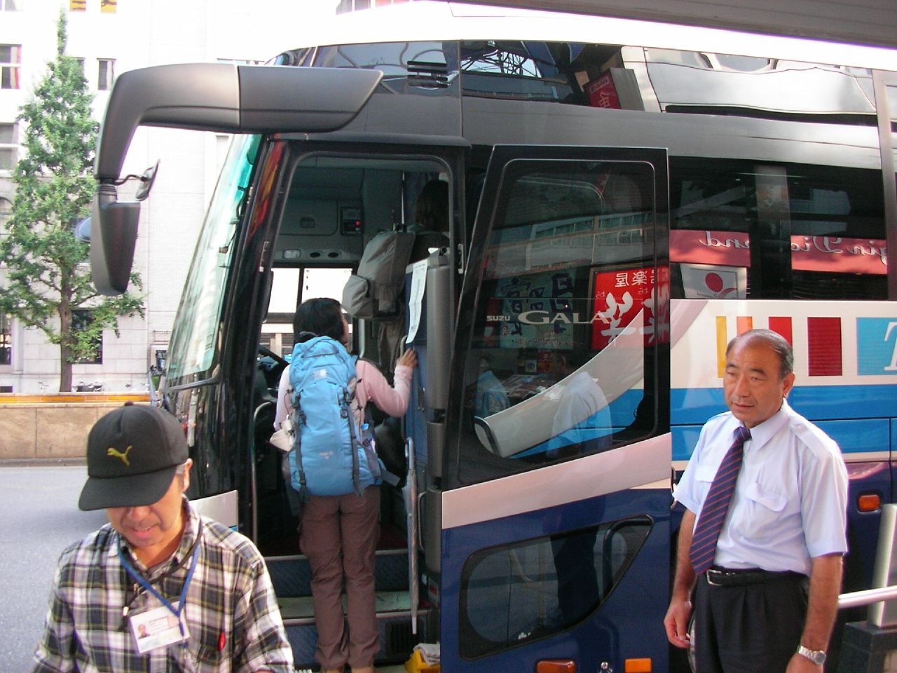 a man and a woman exiting a bus