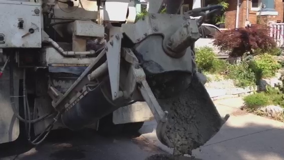 the front end of a construction truck with heavy machinery