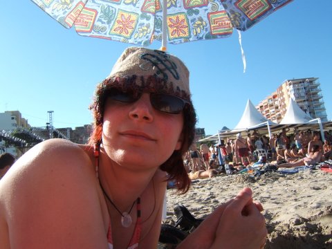 woman posing for camera with umbrella above her head