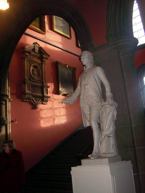 an entry way inside of a building with a statue