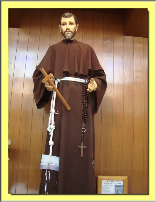 the statue of st benedict in a shrine with two crosses on each of its hands