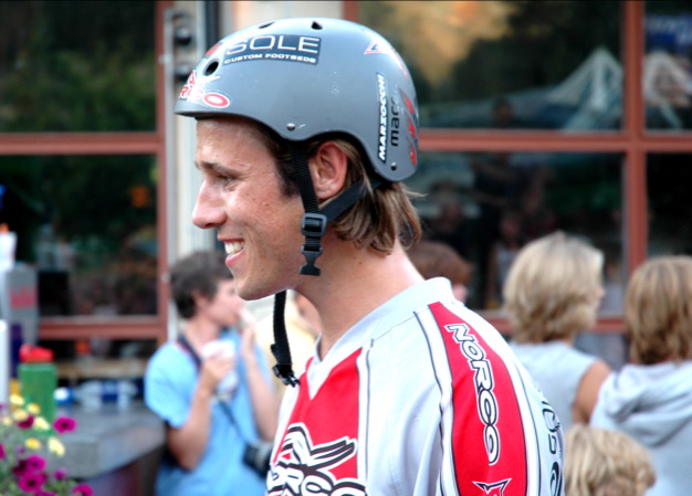 a close up of a person with a helmet on