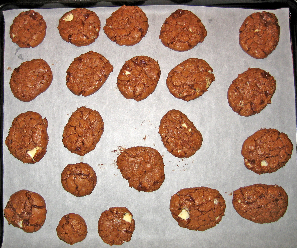 several large cookies on a cookie sheet ready to be baked