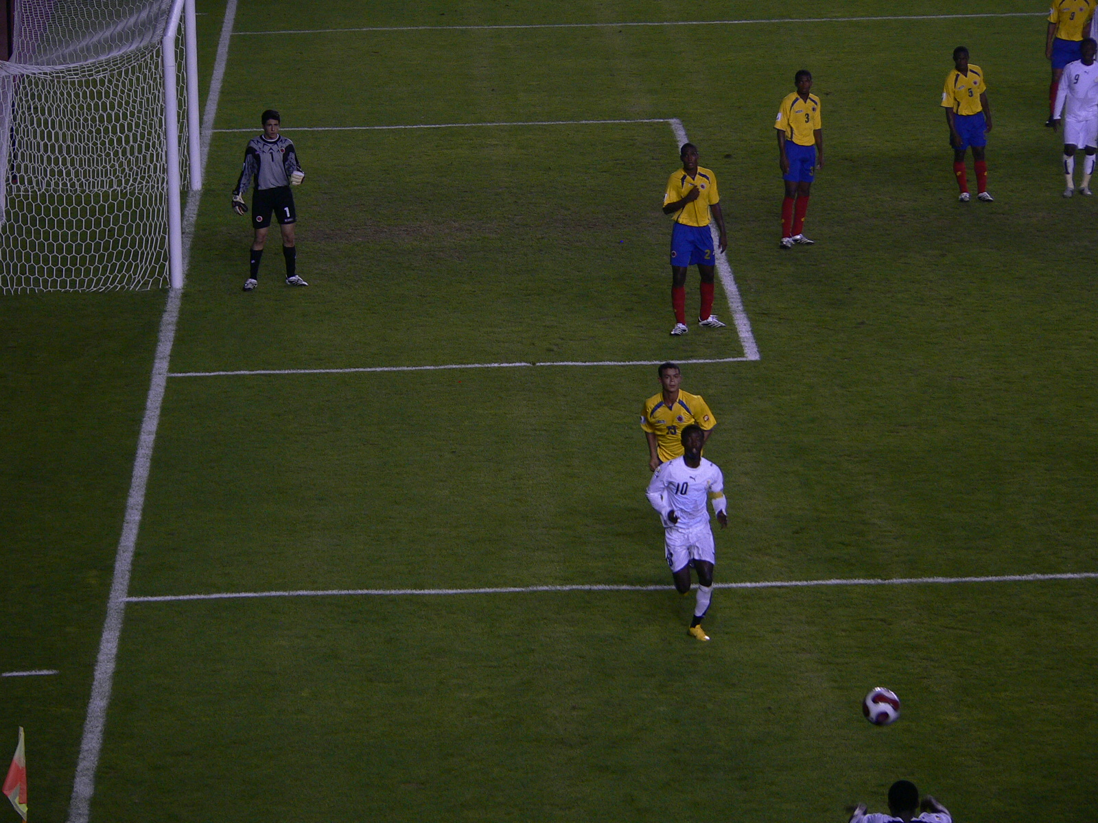 two teams in yellow and white playing a game