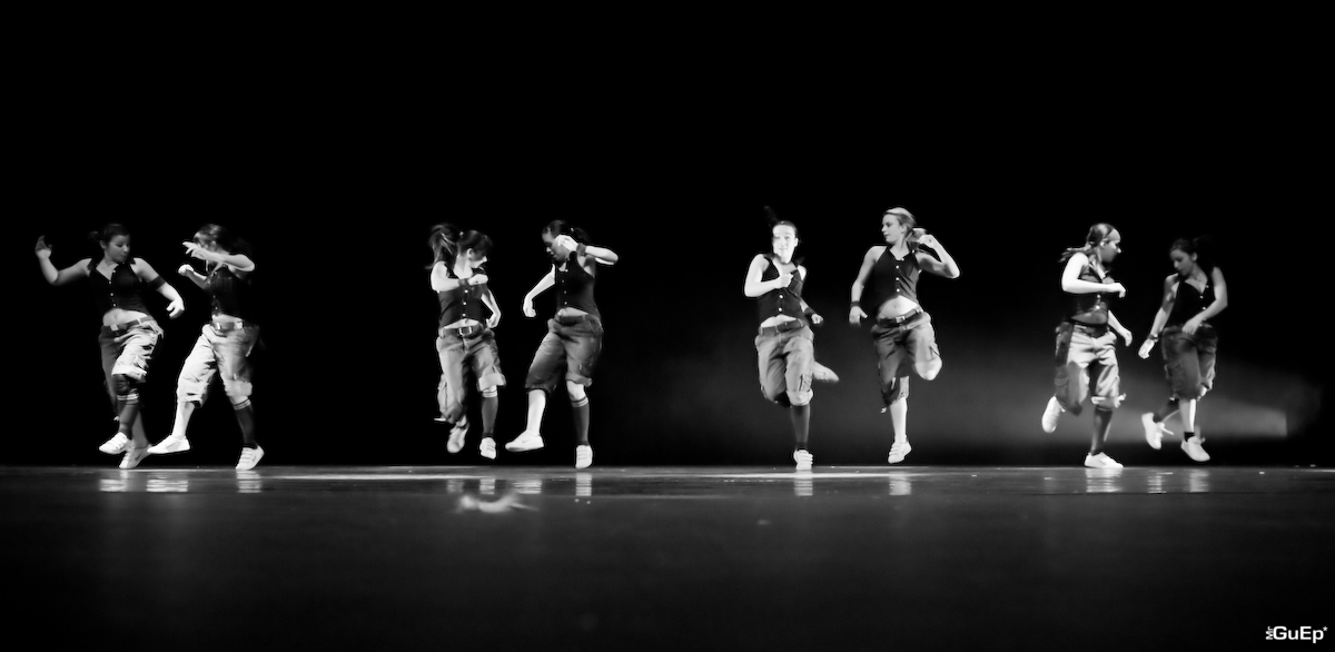 black and white po of young dancers running in line