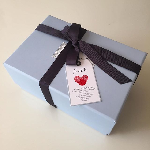 a package of chocolates tied to a ribbon