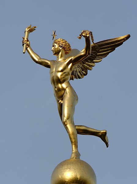the golden statue has angel arms and wings