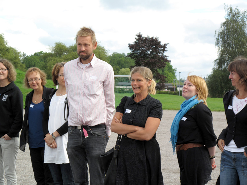 a man is in front of several other women