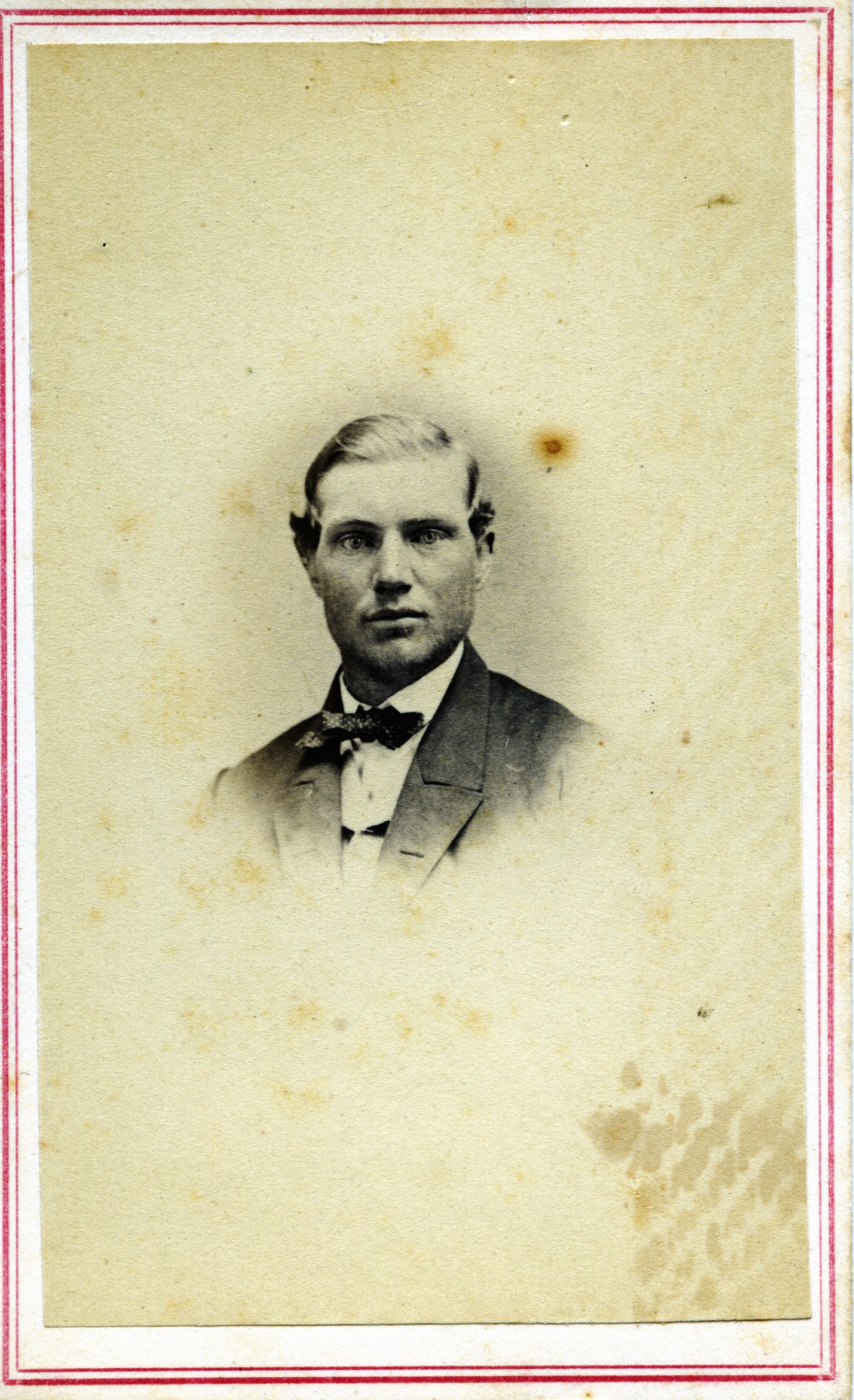 a vintage portrait of a man with a bow tie