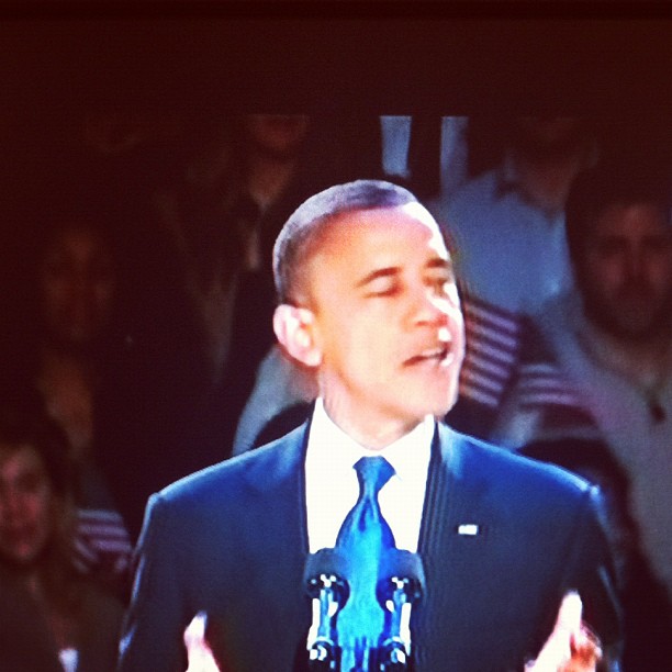 barack obama speaking on stage at a campaign