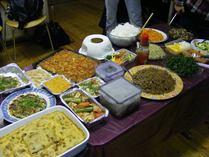 a dining table filled with lots of food