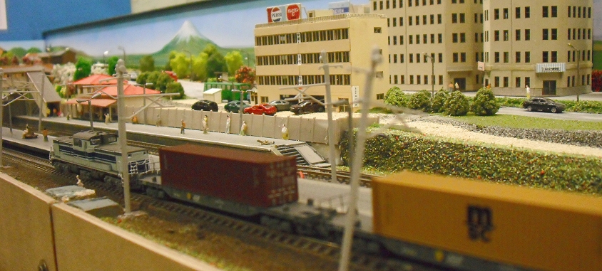 toy model city with train tracks and buildings