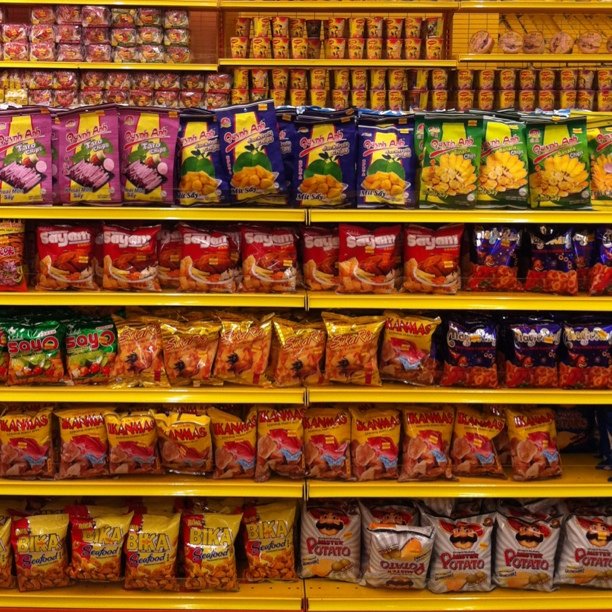 an arrangement of chips and snacks on shelves