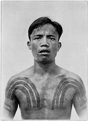 a young man with his tattoo on his chest