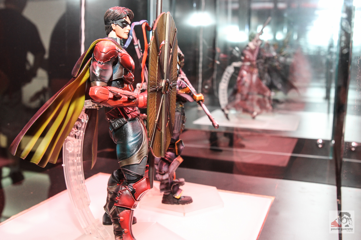 a plastic model is standing with two swords in his hand