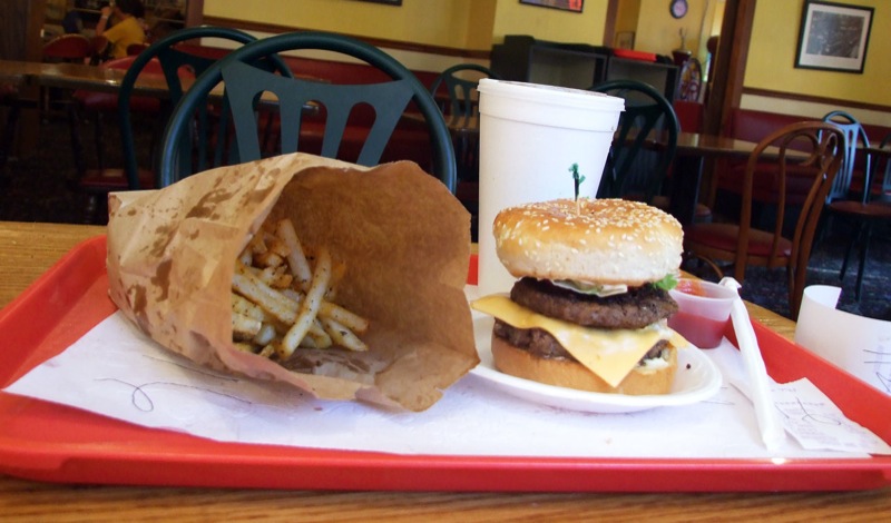 a tray holding a hamburger and french fries