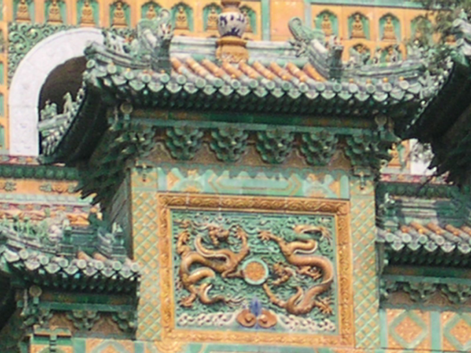 a large ornate building with elaborate roof decorations