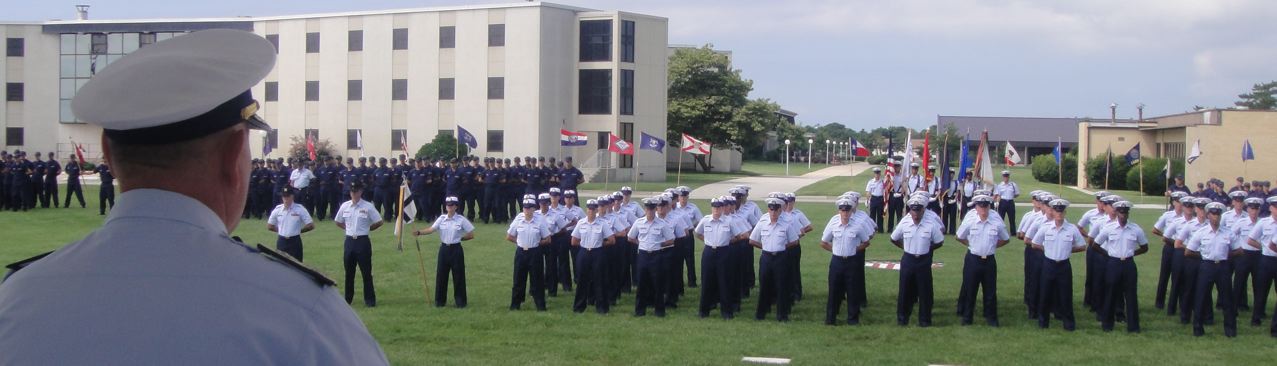 an officer looks down on a group of people in uniform