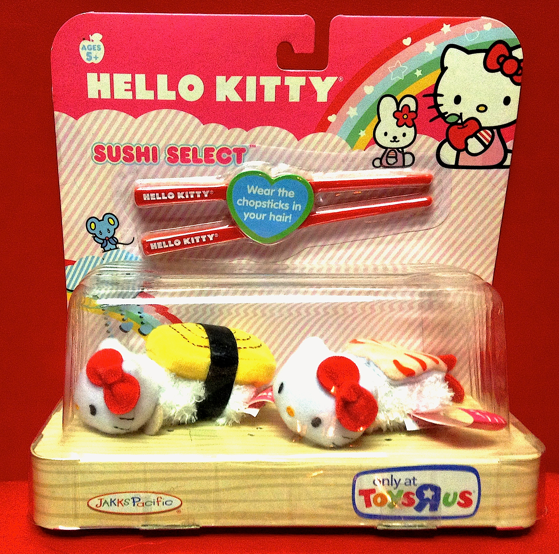 hello kitty with two different hello kitty toys