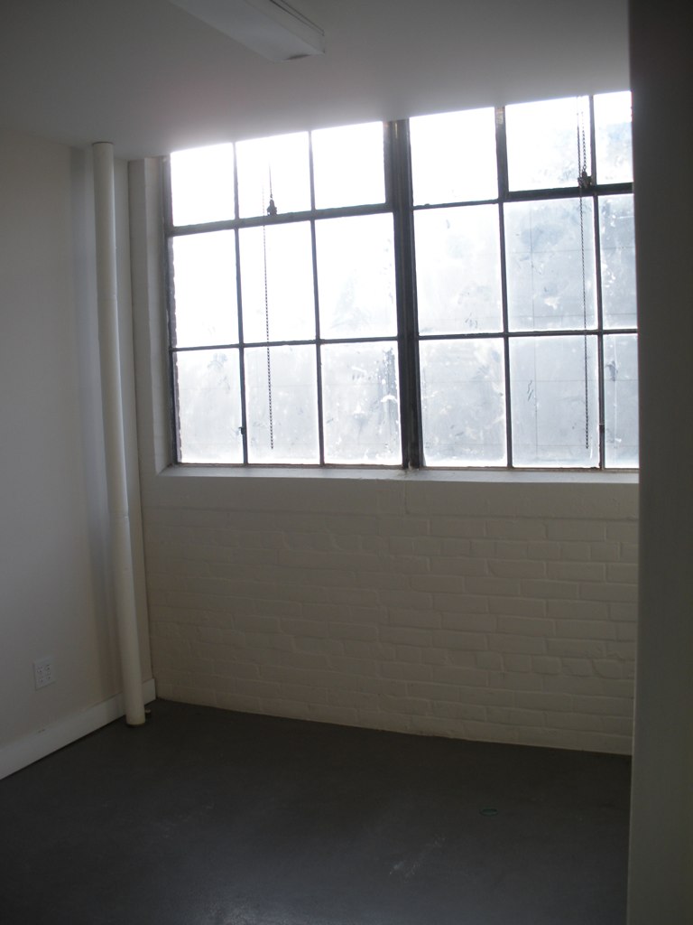 an empty room with a large window in it