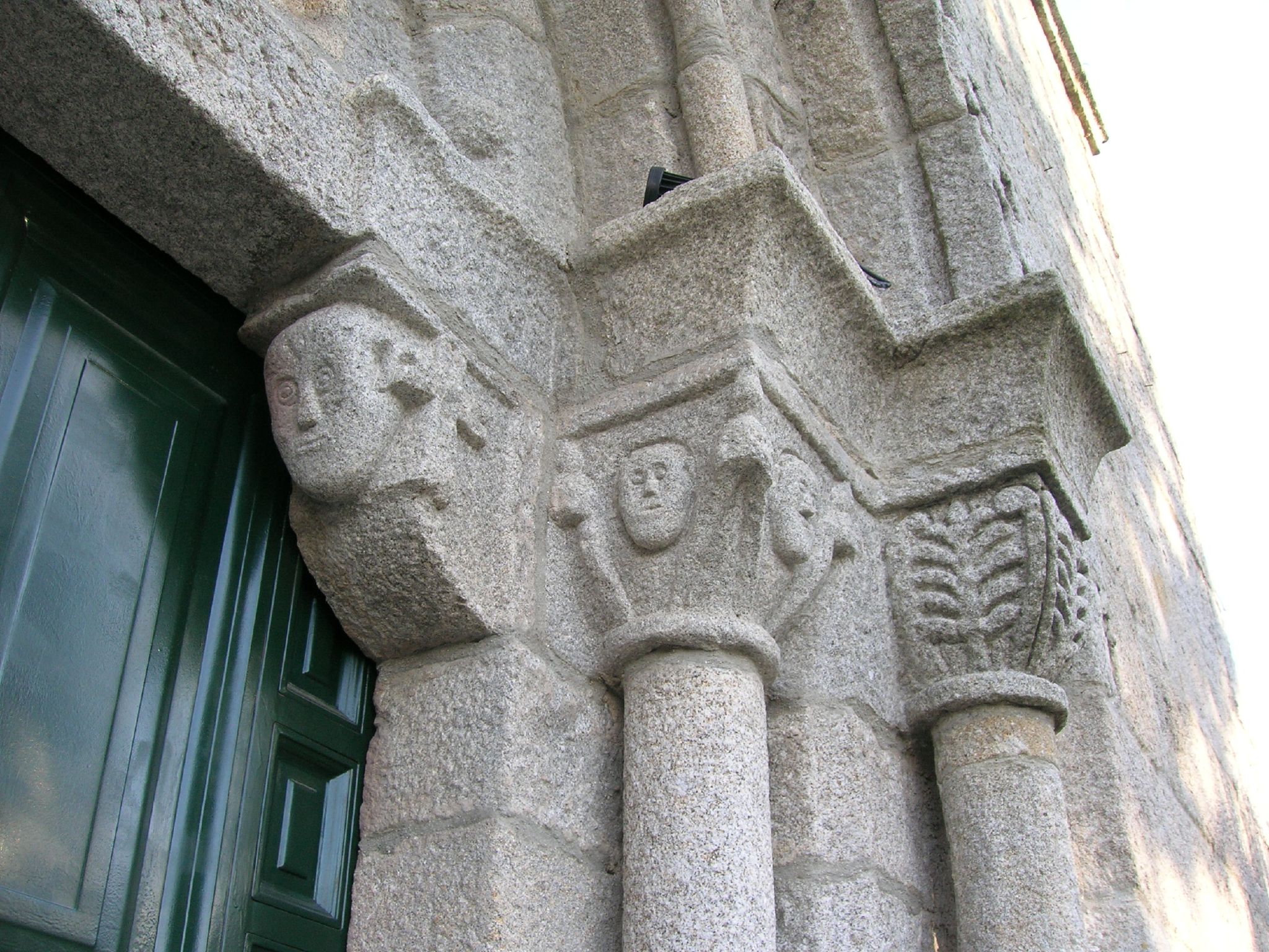 the entrance to the building has a carving of elephants