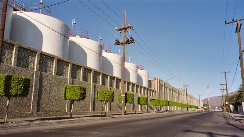 the factory buildings have two rows of water tanks