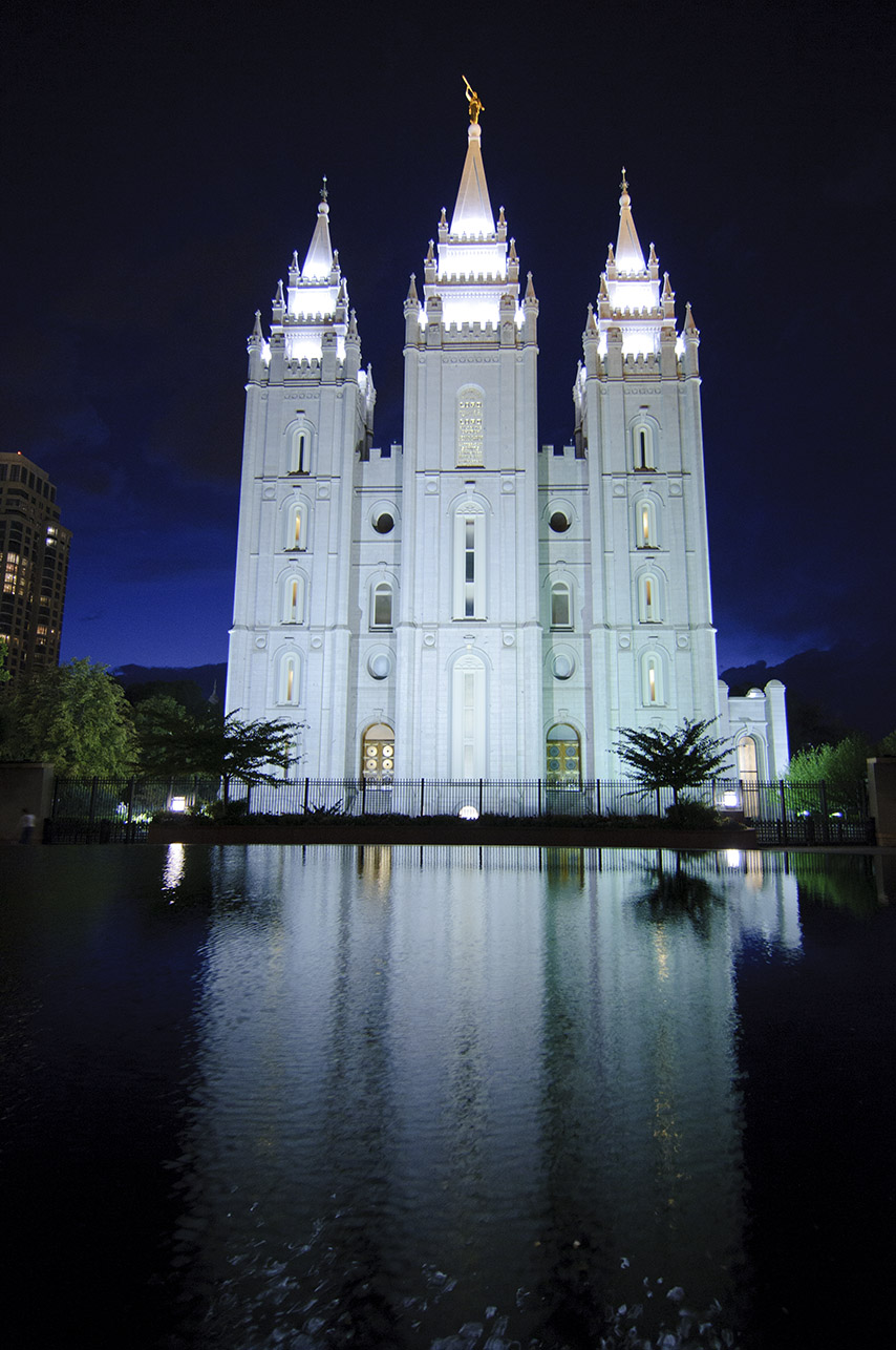 a very large white building that has some lights on it