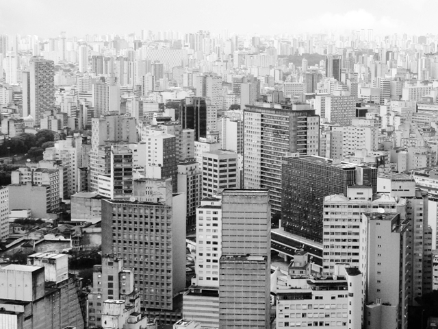 the view from above of city buildings in black and white