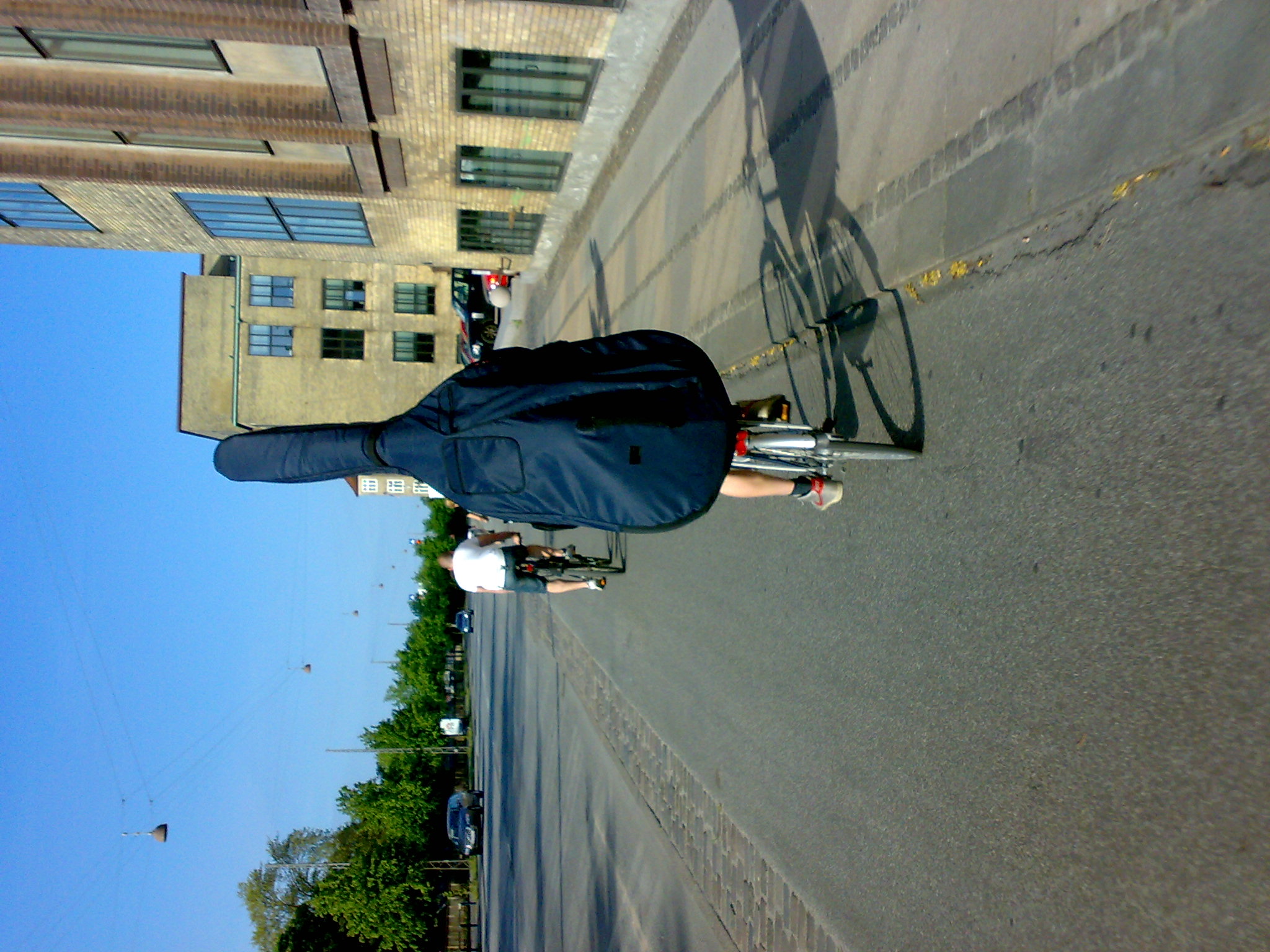 a woman is standing outside on the sidewalk