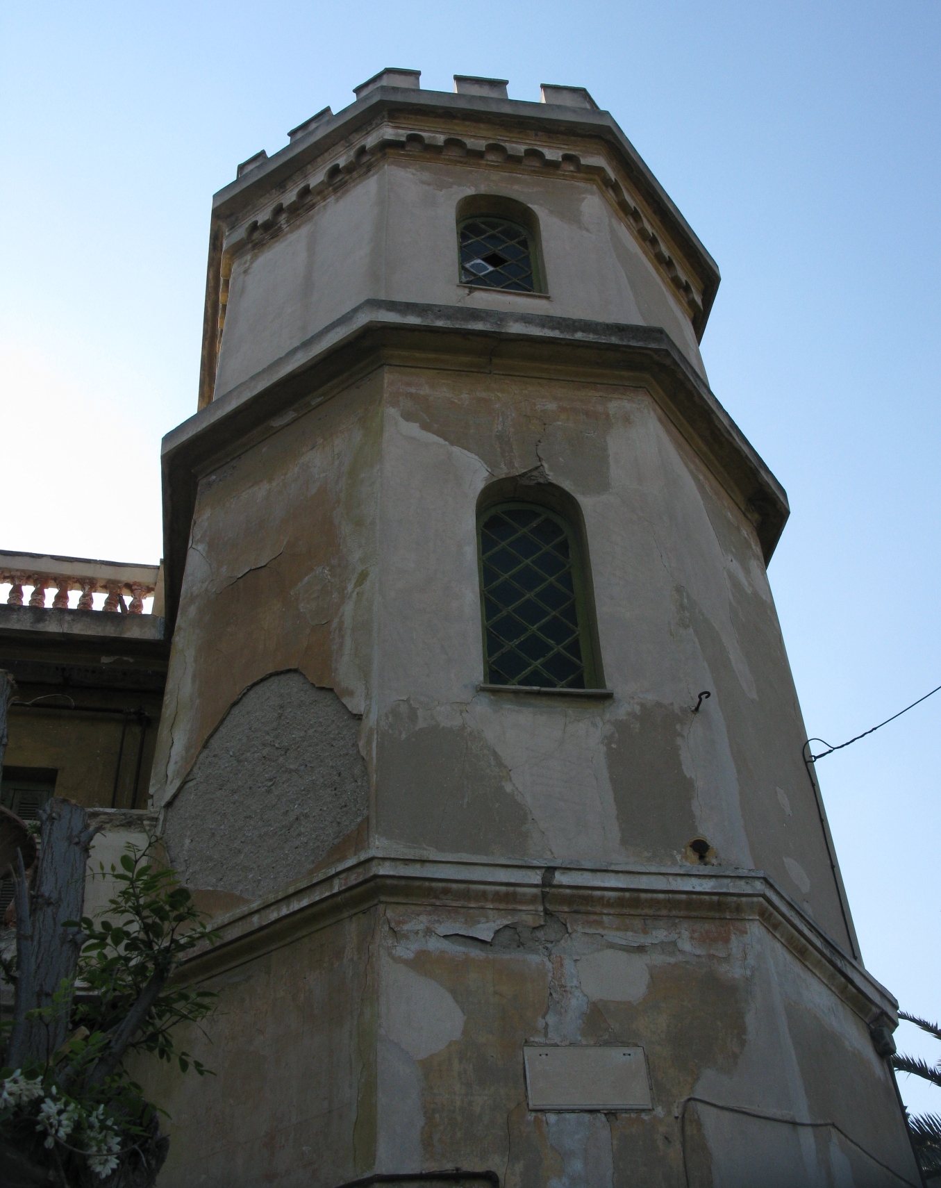 a very old tower with a stained glass window