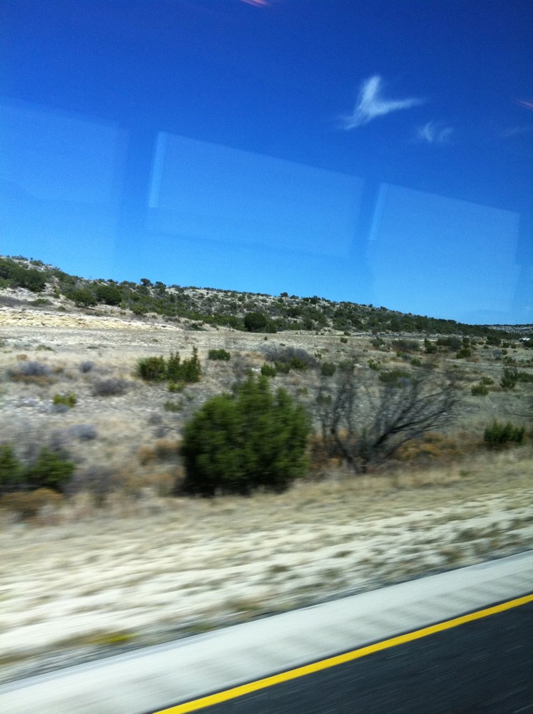 a desert landscape as seen through a moving vehicle