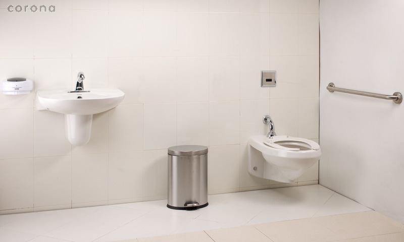 a white toilet sitting next to a white sink