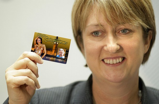 a lady holding up a card with an image on it