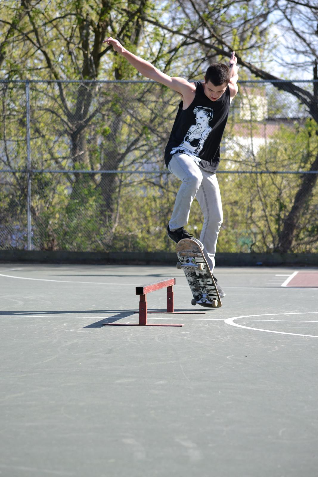 a young man riding a skateboard on top of an obstacle