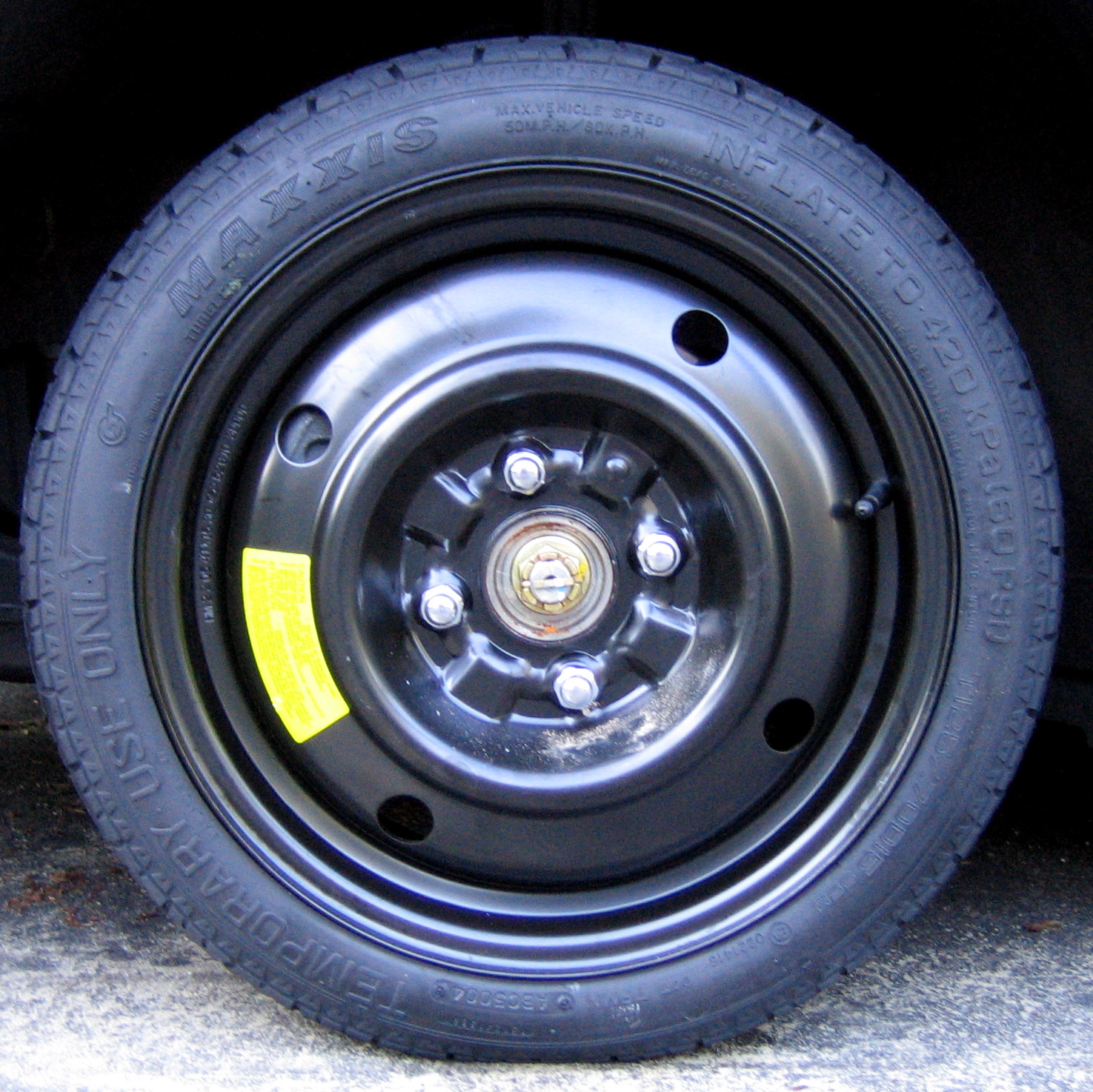 a tire with a yellow stick on the side