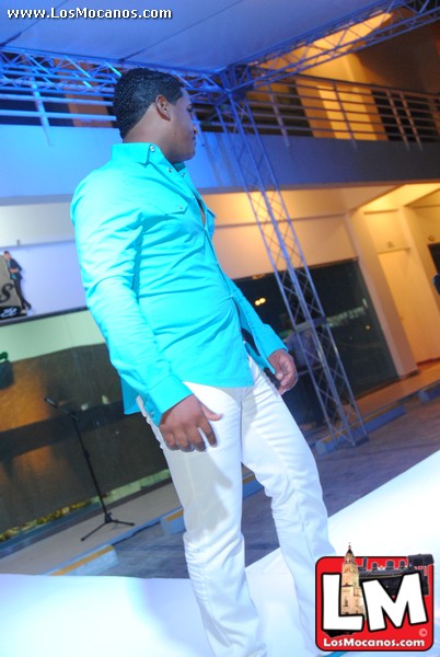 a man in a light blue jacket standing