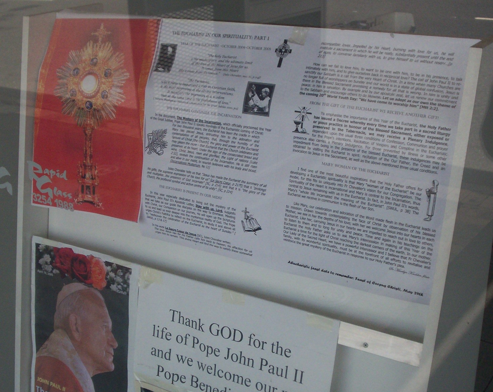 a memorial display with pos and information in a window