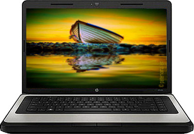 an open laptop computer with a boat in the background