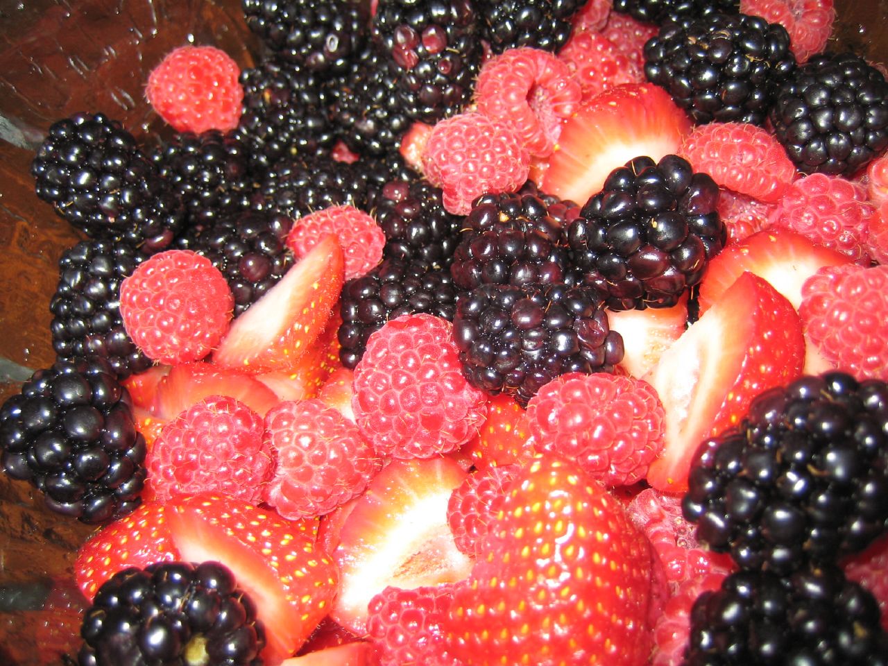 red black and white berries are sitting together