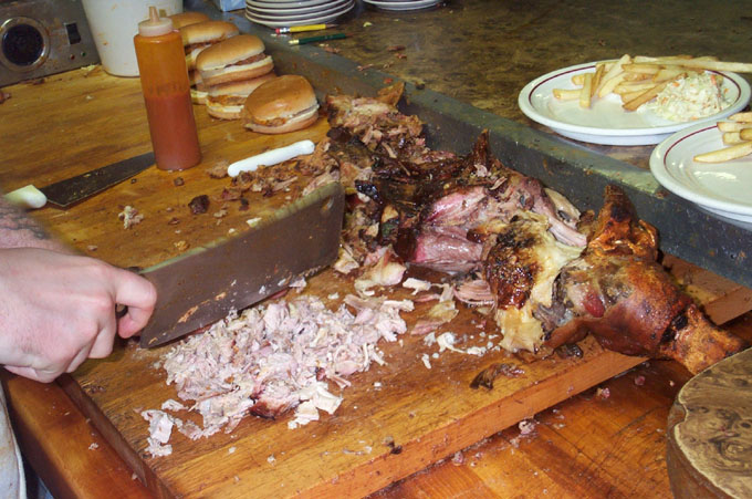 a person  meat on a wooden table