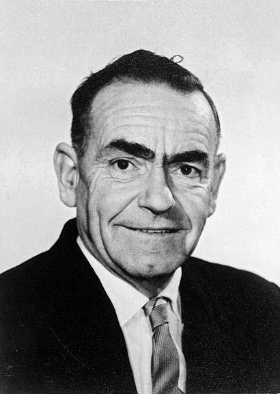 an old black and white po of a man in a suit