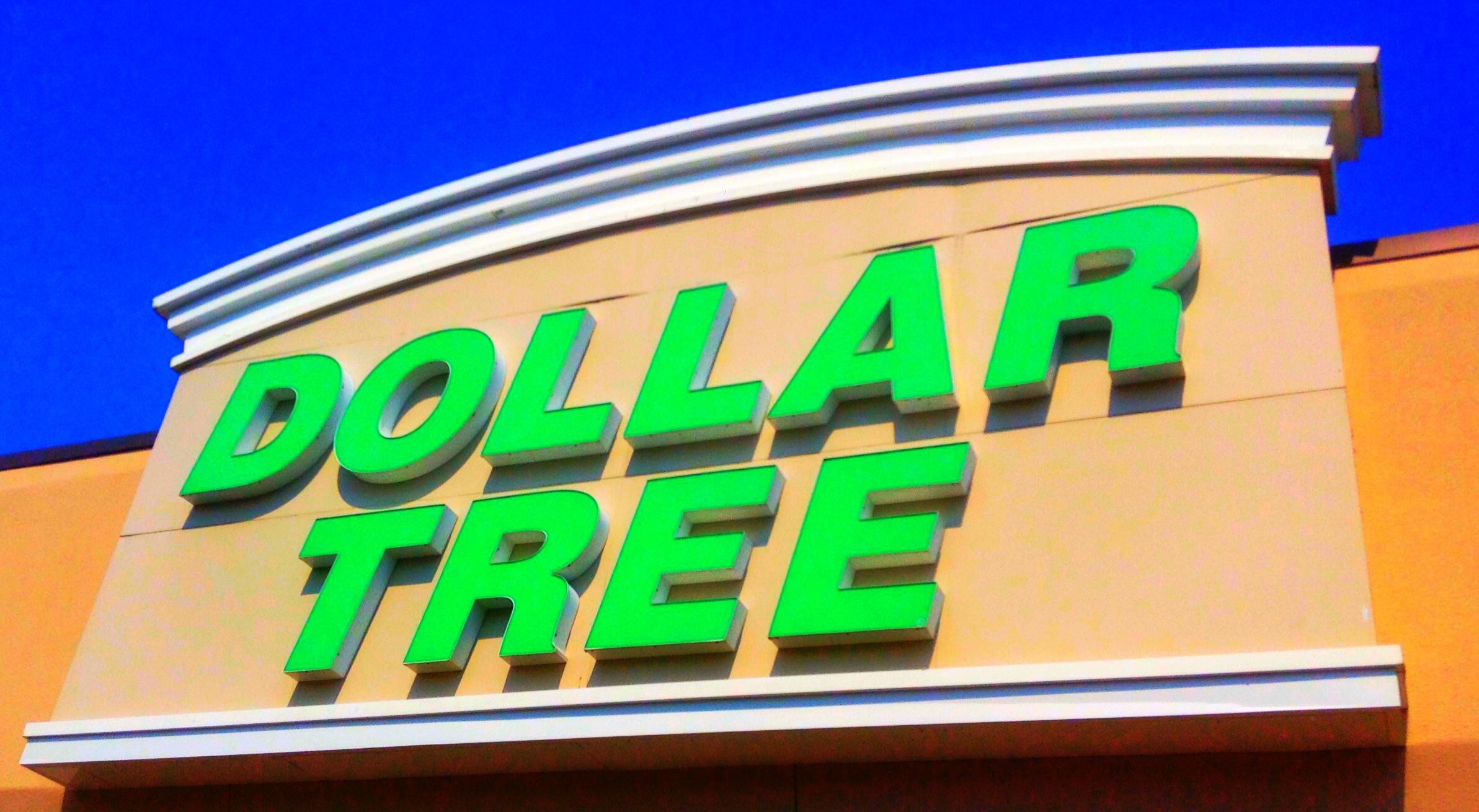 the dollar tree sign is on the outside of a building