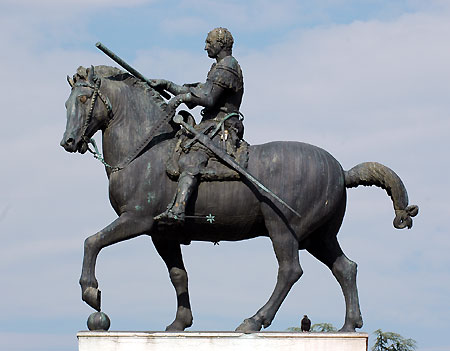 a man on a horse with spear in his hand