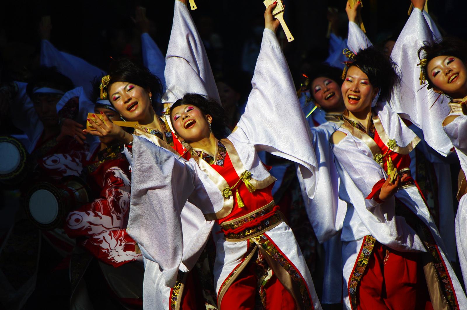 group of asian women in long dress performing a traditional dance